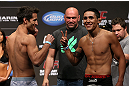 DENVER, CO - AUGUST 10:  (L-R) Opponents Ken Stone and Erik Perez face off during the UFC 150 weigh in at Pepsi Center on August 10, 2012 in Denver, Colorado. (Photo by Josh Hedges/Zuffa LLC/Zuffa LLC via Getty Images)