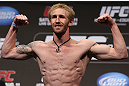 DENVER, CO - AUGUST 10:  Tom Hayden makes weight during the UFC 150 weigh in at Pepsi Center on August 10, 2012 in Denver, Colorado. (Photo by Josh Hedges/Zuffa LLC/Zuffa LLC via Getty Images)