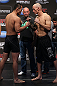 DENVER, CO - AUGUST 10:  (L-R) Opponents Yushin Okami and Buddy Roberts face off during the UFC 150 weigh in at Pepsi Center on August 10, 2012 in Denver, Colorado. (Photo by Josh Hedges/Zuffa LLC/Zuffa LLC via Getty Images)