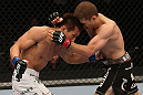 DENVER, CO - AUGUST 11:  (L-R) Eiji Mitsuoka punches to the body of Nik Lentz during their featherweight bout at UFC 150 inside Pepsi Center on August 11, 2012 in Denver, Colorado. (Photo by Nick Laham/Zuffa LLC/Zuffa LLC via Getty Images)