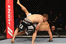 DENVER, CO - AUGUST 11:  (L-R) Nik Lentz takes down Eiji Mitsuoka during their featherweight bout at UFC 150 inside Pepsi Center on August 11, 2012 in Denver, Colorado. (Photo by Nick Laham/Zuffa LLC/Zuffa LLC via Getty Images)
