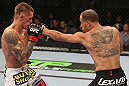 DENVER, CO - AUGUST 11:  (R-L) Chico Camus punches Dustin Pague during their bantamweight bout at UFC 150 inside Pepsi Center on August 11, 2012 in Denver, Colorado. (Photo by Nick Laham/Zuffa LLC/Zuffa LLC via Getty Images)