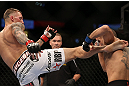 DENVER, CO - AUGUST 11:  (L-R) Dustin Pague kicks Chico Camus during their bantamweight bout at UFC 150 inside Pepsi Center on August 11, 2012 in Denver, Colorado. (Photo by Josh Hedges/Zuffa LLC/Zuffa LLC via Getty Images)