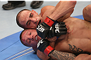 DENVER, CO - AUGUST 11:  (R-L) Chico Camus attempts a rear choke submission against Dustin Pague during their bantamweight bout at UFC 150 inside Pepsi Center on August 11, 2012 in Denver, Colorado. (Photo by Nick Laham/Zuffa LLC/Zuffa LLC via Getty Images)