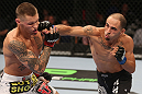 DENVER, CO - AUGUST 11:  (R-L) Chico Camus punches Dustin Pague during their bantamweight bout at UFC 150 inside Pepsi Center on August 11, 2012 in Denver, Colorado. (Photo by Nick Laham/Zuffa LLC/Zuffa LLC via Getty Images)