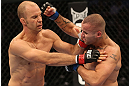 DENVER, CO - AUGUST 11:  (R-L) Michael Kuiper punches Jared Hamman during their middleweight bout at UFC 150 inside Pepsi Center on August 11, 2012 in Denver, Colorado. (Photo by Nick Laham/Zuffa LLC/Zuffa LLC via Getty Images)