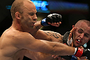 DENVER, CO - AUGUST 11:  (R-L) Michael Kuiper punches Jared Hamman during their middleweight bout at UFC 150 inside Pepsi Center on August 11, 2012 in Denver, Colorado. (Photo by Josh Hedges/Zuffa LLC/Zuffa LLC via Getty Images)