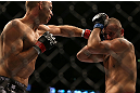 DENVER, CO - AUGUST 11:  (L-R) Jared Hamman punches Michael Kuiper during their middleweight bout at UFC 150 inside Pepsi Center on August 11, 2012 in Denver, Colorado. (Photo by Josh Hedges/Zuffa LLC/Zuffa LLC via Getty Images)