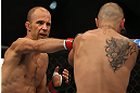 DENVER, CO - AUGUST 11:  (L-R) Jared Hamman punches Michael Kuiper during their middleweight bout at UFC 150 inside Pepsi Center on August 11, 2012 in Denver, Colorado. (Photo by Josh Hedges/Zuffa LLC/Zuffa LLC via Getty Images)