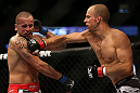 DENVER, CO - AUGUST 11:  (R-L) Jared Hamman punches Michael Kuiper during their middleweight bout at UFC 150 inside Pepsi Center on August 11, 2012 in Denver, Colorado. (Photo by Josh Hedges/Zuffa LLC/Zuffa LLC via Getty Images)