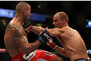 DENVER, CO - AUGUST 11:  (R-L) Jared Hamman punches Michael Kuiper during their middleweight bout at UFC 150 inside Pepsi Center on August 11, 2012 in Denver, Colorado. (Photo by Josh Hedges/Zuffa LLC/Zuffa LLC via Getty Images)