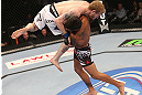 DENVER, CO - AUGUST 11:  (R-L) Dennis Bermudez takes down Tommy Hayden during their featherweight bout at UFC 150 inside Pepsi Center on August 11, 2012 in Denver, Colorado. (Photo by Nick Laham/Zuffa LLC/Zuffa LLC via Getty Images)
