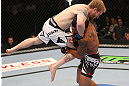 DENVER, CO - AUGUST 11:  (R-L) Dennis Bermudez takes down Tommy Hayden during their featherweight bout at UFC 150 inside Pepsi Center on August 11, 2012 in Denver, Colorado. (Photo by Nick Laham/Zuffa LLC/Zuffa LLC via Getty Images)