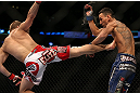 DENVER, CO - AUGUST 11:  (L-R) Justin Lawrence kicks Max Holloway during their featherweight bout at UFC 150 inside Pepsi Center on August 11, 2012 in Denver, Colorado. (Photo by Josh Hedges/Zuffa LLC/Zuffa LLC via Getty Images)