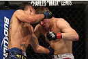 DENVER, CO - AUGUST 11:  (L-R) Max Holloway punches Justin Lawrence during their featherweight bout at UFC 150 inside Pepsi Center on August 11, 2012 in Denver, Colorado. (Photo by Josh Hedges/Zuffa LLC/Zuffa LLC via Getty Images)