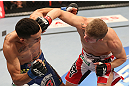 DENVER, CO - AUGUST 11:  (R-L) Justin Lawrence punches Max Holloway during their featherweight bout at UFC 150 inside Pepsi Center on August 11, 2012 in Denver, Colorado. (Photo by Nick Laham/Zuffa LLC/Zuffa LLC via Getty Images)