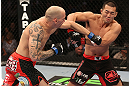 DENVER, CO - AUGUST 11:  (L-R) Buddy Roberts punches Yushin Okami during their middleweight bout at UFC 150 inside Pepsi Center on August 11, 2012 in Denver, Colorado. (Photo by Nick Laham/Zuffa LLC/Zuffa LLC via Getty Images)