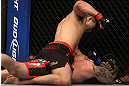 DENVER, CO - AUGUST 11:  Yushin Okami (top) punches down at Buddy Roberts during their middleweight bout at UFC 150 inside Pepsi Center on August 11, 2012 in Denver, Colorado. (Photo by Josh Hedges/Zuffa LLC/Zuffa LLC via Getty Images)