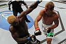 DENVER, CO - AUGUST 11:  (R-L) Donald "Cowboy" Cerrone knocks out Melvin Guillard with a punch during their lightweight bout at UFC 150 inside Pepsi Center on August 11, 2012 in Denver, Colorado. (Photo by Josh Hedges/Zuffa LLC/Zuffa LLC via Getty Images)