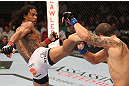 DENVER, CO - AUGUST 11:  (L-R) Benson Henderson kicks Frankie Edgar during their lightweight championship bout at UFC 150 inside Pepsi Center on August 11, 2012 in Denver, Colorado. (Photo by Nick Laham/Zuffa LLC/Zuffa LLC via Getty Images)