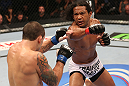 DENVER, CO - AUGUST 11:  (R-L) Benson Henderson punches Frankie Edgar during their lightweight championship bout at UFC 150 inside Pepsi Center on August 11, 2012 in Denver, Colorado. (Photo by Nick Laham/Zuffa LLC/Zuffa LLC via Getty Images)