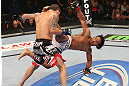 DENVER, CO - AUGUST 11:  (R-L) Benson Henderson kicks Frankie Edgar during their lightweight championship bout at UFC 150 inside Pepsi Center on August 11, 2012 in Denver, Colorado. (Photo by Nick Laham/Zuffa LLC/Zuffa LLC via Getty Images)