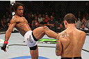 DENVER, CO - AUGUST 11:  (L-R) Benson Henderson kicks Frankie Edgar during their lightweight championship bout at UFC 150 inside Pepsi Center on August 11, 2012 in Denver, Colorado. (Photo by Nick Laham/Zuffa LLC/Zuffa LLC via Getty Images)