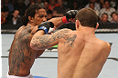 DENVER, CO - AUGUST 11:  (L-R) Benson Henderson punches Frankie Edgar during their lightweight championship bout at UFC 150 inside Pepsi Center on August 11, 2012 in Denver, Colorado. (Photo by Nick Laham/Zuffa LLC/Zuffa LLC via Getty Images)