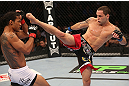 DENVER, CO - AUGUST 11:  (R-L) Frankie Edgar kicks Benson Henderson during their lightweight championship bout at UFC 150 inside Pepsi Center on August 11, 2012 in Denver, Colorado. (Photo by Nick Laham/Zuffa LLC/Zuffa LLC via Getty Images)