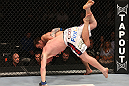 DENVER, CO - AUGUST 11:  (R-L) Jake Shields takes down Ed Herman during their middleweight bout at UFC 150 inside Pepsi Center on August 11, 2012 in Denver, Colorado. (Photo by Nick Laham/Zuffa LLC/Zuffa LLC via Getty Images)