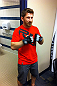 DENVER, CO - AUGUST 11:  UFC fighter Mike Brown tries on gloves while his teammate Ken Stone gets wrapped at UFC 150 inside Pepsi Center on August 11, 2012 in Denver, Colorado. (Zuffa LLC)