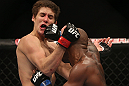 TORONTO, CANADA - SEPTEMBER 22: (R-L) Marcus Brimage punches Jimy Hettes during their featherweight bout at UFC 152 inside Air Canada Centre on September 22, 2012 in Toronto, Ontario, Canada. (Photo by Josh Hedges/Zuffa LLC/Zuffa LLC via Getty Images)