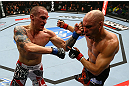 TORONTO, CANADA - SEPTEMBER 22: (L-R) Lance Benoist punches Sean Pierson during their welterweight bout at UFC 152 inside Air Canada Centre on September 22, 2012 in Toronto, Ontario, Canada. (Photo by Al Bello/Zuffa LLC/Zuffa LLC via Getty Images)