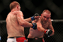TORONTO, CANADA - SEPTEMBER 22: (R-L) T.J. Grant punches Evan Dunham during their lightweight bout at UFC 152 inside Air Canada Centre on September 22, 2012 in Toronto, Ontario, Canada. (Photo by Josh Hedges/Zuffa LLC/Zuffa LLC via Getty Images)