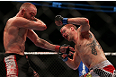 TORONTO, CANADA - SEPTEMBER 22: (R-L) Evan Dunham punches T.J. Grant during their lightweight bout at UFC 152 inside Air Canada Centre on September 22, 2012 in Toronto, Ontario, Canada. (Photo by Josh Hedges/Zuffa LLC/Zuffa LLC via Getty Images)