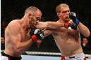 TORONTO, CANADA - SEPTEMBER 22: (L-R) T.J. Grant and Evan Dunham trade punches during their lightweight bout at UFC 152 inside Air Canada Centre on September 22, 2012 in Toronto, Ontario, Canada. (Photo by Al Bello/Zuffa LLC/Zuffa LLC via Getty Images)