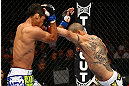 TORONTO, CANADA - SEPTEMBER 22:    (R-L) Cub Swanson punches Charles Oliveira during their featherweight bout at UFC 152 inside Air Canada Centre on September 22, 2012 in Toronto, Ontario, Canada.  (Photo by Al Bello/Zuffa LLC/Zuffa LLC via Getty Images)