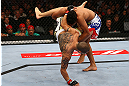 TORONTO, CANADA - SEPTEMBER 22:    (R-L) Charles Oliveira takes down Cub Swanson during their featherweight bout at UFC 152 inside Air Canada Centre on September 22, 2012 in Toronto, Ontario, Canada.  (Photo by Al Bello/Zuffa LLC/Zuffa LLC via Getty Images)