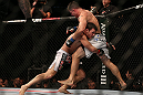 TORONTO, CANADA - SEPTEMBER 22: (L-R) Michael Bisping takes down Brian Stann during their middleweight bout at UFC 152 inside Air Canada Centre on September 22, 2012 in Toronto, Ontario, Canada. (Photo by Josh Hedges/Zuffa LLC/Zuffa LLC via Getty Images)