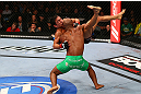 TORONTO, CANADA - SEPTEMBER 22: Demetrious Johnson (green shorts) takes down Joseph Benavidez during their flyweight championship bout at UFC 152 inside Air Canada Centre on September 22, 2012 in Toronto, Ontario, Canada. (Photo by Al Bello/Zuffa LLC/Zuffa LLC via Getty Images)