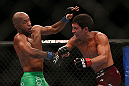 TORONTO, CANADA - SEPTEMBER 22:    (R-L) Joseph Benavidez punches Demetrious Johnson during their flyweight championship bout at UFC 152 inside Air Canada Centre on September 22, 2012 in Toronto, Ontario, Canada.  (Photo by Josh Hedges/Zuffa LLC/Zuffa LLC via Getty Images)