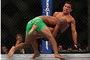 TORONTO, CANADA - SEPTEMBER 22:    (L-R) Demetrious Johnson takes down Joseph Benavidez during their flyweight championship bout at UFC 152 inside Air Canada Centre on September 22, 2012 in Toronto, Ontario, Canada.  (Photo by Josh Hedges/Zuffa LLC/Zuffa LLC via Getty Images)