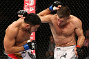 NOTTINGHAM, ENGLAND - SEPTEMBER 29:  (R-L) Tom Watson and Brad Tavares trade punches during their middleweight fight at the UFC on Fuel TV event at Capital FM Arena on September 29, 2012 in Nottingham, England.  (Photo by Josh Hedges/Zuffa LLC/Zuffa LLC via Getty Images)