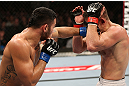 NOTTINGHAM, ENGLAND - SEPTEMBER 29:  (L-R) Brad Tavares punches Tom Watson during their middleweight fight at the UFC on Fuel TV event at Capital FM Arena on September 29, 2012 in Nottingham, England.  (Photo by Josh Hedges/Zuffa LLC/Zuffa LLC via Getty Images)