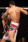 NOTTINGHAM, ENGLAND - SEPTEMBER 29:  (R-L) Brad Tavares delivers a flying knee against Tom Watson during their middleweight fight at the UFC on Fuel TV event at Capital FM Arena on September 29, 2012 in Nottingham, England.  (Photo by Josh Hedges/Zuffa LLC/Zuffa LLC via Getty Images)