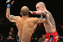 NOTTINGHAM, ENGLAND - SEPTEMBER 29:  (R-L) Andy Ogle punches Akira Corassani during their featherweight fight at the UFC on Fuel TV event at Capital FM Arena on September 29, 2012 in Nottingham, England.  (Photo by Josh Hedges/Zuffa LLC/Zuffa LLC via Getty Images)