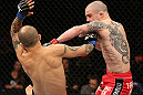 NOTTINGHAM, ENGLAND - SEPTEMBER 29:  (R-L) Andy Ogle punches Akira Corassani during their featherweight fight at the UFC on Fuel TV event at Capital FM Arena on September 29, 2012 in Nottingham, England.  (Photo by Josh Hedges/Zuffa LLC/Zuffa LLC via Getty Images)