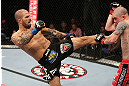 NOTTINGHAM, ENGLAND - SEPTEMBER 29:  (L-R) Akira Corassani kicks Andy Ogle during their featherweight fight at the UFC on Fuel TV event at Capital FM Arena on September 29, 2012 in Nottingham, England.  (Photo by Josh Hedges/Zuffa LLC/Zuffa LLC via Getty Images)