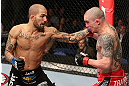 NOTTINGHAM, ENGLAND - SEPTEMBER 29:  (L-R) Akira Corassani punches Andy Ogle during their featherweight fight at the UFC on Fuel TV event at Capital FM Arena on September 29, 2012 in Nottingham, England.  (Photo by Josh Hedges/Zuffa LLC/Zuffa LLC via Getty Images)
