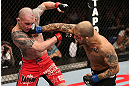 NOTTINGHAM, ENGLAND - SEPTEMBER 29:  (R-L) Akira Corassani punches Andy Ogle during their featherweight fight at the UFC on Fuel TV event at Capital FM Arena on September 29, 2012 in Nottingham, England.  (Photo by Josh Hedges/Zuffa LLC/Zuffa LLC via Getty Images)